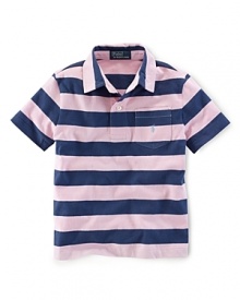 A classic polo is rendered in striped jersey-knit cotton for a preppy look. A classic polo is rendered in striped jersey-knit cotton for a preppy look.