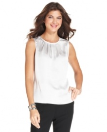 A satiny fabric and soft pleating at the neckline make this petite shell from Jones New York a versatile favorite for creating workday looks. A satiny fabric and soft pleating at the neckline make this petite shell from Jones New York a versatile favorite for creating workday looks.