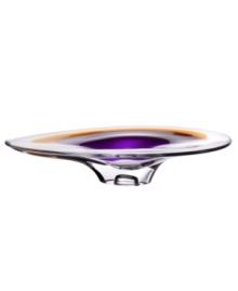 With the extraordinary beauty and grace of an orchid blossom, this Kosta Boda platter adds brilliant artistry to modern interiors. Luxurious art glass hand-crafted in a wide, fluid shape glistens with streaks of rich violet and warm amber. With the extraordinary beauty and grace of an orchid blossom, this Kosta Boda platter adds brilliant artistry to modern interiors. Luxurious art glass hand-crafted in a wide, fluid shape glistens with streaks of rich violet and warm amber.