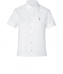 Styled with a slightly cropped boxy cut, Ralph Laurens white button-down is a modern take on this iconic style - Cutaway collar, short sleeves, slit cuffs, button-down front, straight hemline, slit sides - Slightly boxy, straight silhouette - Wear with figure-hugging separates and statement chunky jewelry