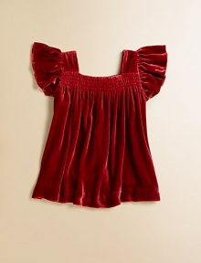A rich, shimmery velvet top, accented with fluttery sleeves and smocking, is perfect for holiday gatherings.SquareneckFlutter cap sleevesPullover styleFully linedRayon/SilkDry cleanImported A rich, shimmery velvet top, accented with fluttery sleeves and smocking, is perfect for holiday gatherings.SquareneckFlutter cap sleevesPullover styleFully linedRayon/SilkDry cleanImported