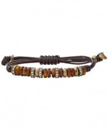 Neutralize your look. Subtle semi-precious tiger's eye and clear crystal beads decorate Fossil's trendy brown leather wrap bracelet. Set in brass tone mixed metal. Bracelet adjusts to fit wrist. Approximate diameter: 2-1/2 inches.