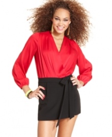 Serve up sass plus class in this skorts romper from XOXO. Long sleeves make the one-piece perfect for autumn nights, while the colorblock design and chic wrap-style totally makes us swoon.