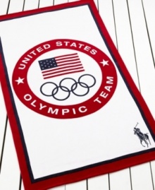 Go for the gold! Everyone's a winner with this Olympic Logo beach towel from Lauren Ralph Lauren, featuring patriotic red, white and blue colors with the signature Olympic rings and Ralph Lauren polo player.