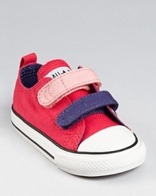 Cute color comes to Converse with this sneaker featuring easy-on, easy-off velcro straps and contrast piping. Cute color comes to Converse with this sneaker featuring easy-on, easy-off velcro straps and contrast piping.