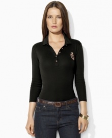 Sleek gold-toned buttons and a metallic embroidered crest lend regal elegance to Lauren Ralph Lauren's soft cotton polo shirt.