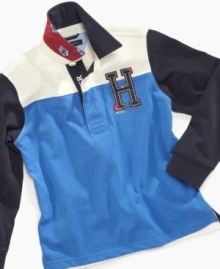 Who says a rugby shirt has to be striped? Tommy Hilfiger outfits this season's star player in a sturdy cotton shirt styled with color blocking and championship graphics. Who says a rugby shirt has to be striped? Tommy Hilfiger outfits this season's star player in a sturdy cotton shirt styled with color blocking and championship graphics.