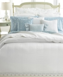 A vintage scroll pattern in a muted blue and white palette adorns this fitted sheet from Lauren by Ralph Lauren for a traditional and elegant allure. A vintage scroll pattern in a muted blue and white palette adorns this fitted sheet from Lauren by Ralph Lauren for a traditional and elegant allure.