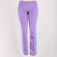 The brushed fabric inside these women's track pants make for a super comfortable fit. Featuring and elasticized waist with drawcord, pin-tucking on legs, front zip pockets, & ankle zips. 100% Polyester Tricot. Machine wash. Imported.