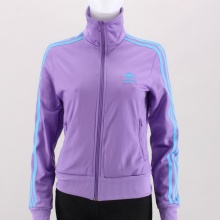 This is one good looking women's track top. This classic returns with the legendary 3-stripes detail, full zip front, stand up collar, and finished with ribbed cuffs & hem. 100% Polyester Tricot. Machine Wash. Imported. This is one good looking women's track top. This classic returns with the legendary 3-stripes detail, full zip front, stand up collar, and finished with ribbed cuffs & hem. 100% Polyester Tricot. Machine Wash. Imported.